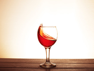 Bordeaux wine in the glass on the table. The concept of beverages and alcohol.