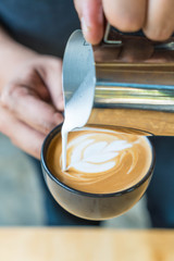 Making of latte art by barista