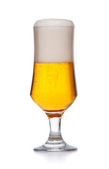 Glass of fresh beer with cap of foam isolated.
