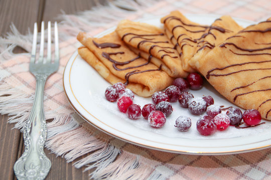 Pancakes with chocolate and berries