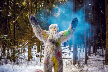 Yeti fairy tale character in winter forest. Outdoor fantasy photo.