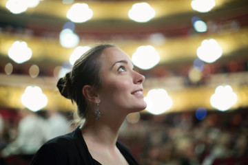 Woman in auditorium of teatre