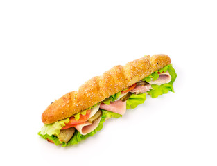 long sandwich with ham and cheese on white background