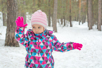 a child walking in the winter forest