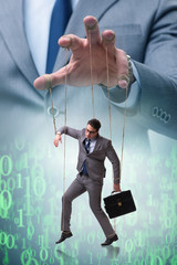 Businessman puppet being manipulated by boss