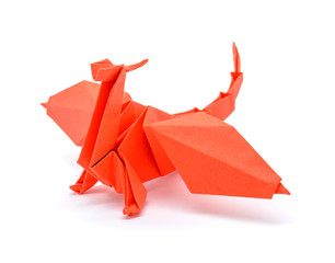 Photo of origami red dragon isolated on white background