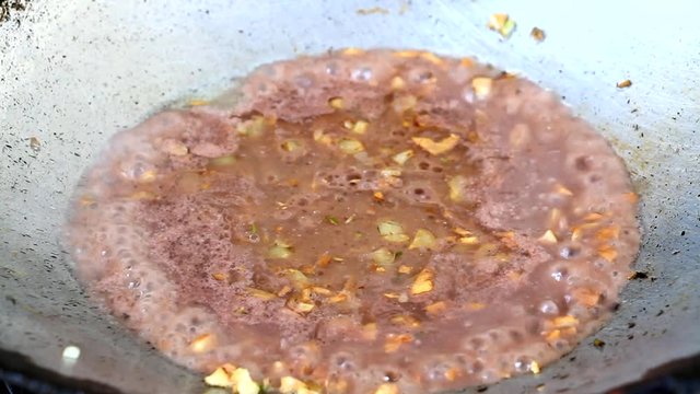 frying shrimp paste or kapi with onion