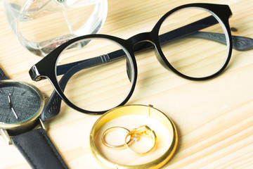 Fashion watches and glasses on the table