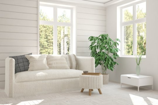 White room with sofa and green landscape in window. Scandinavian interior design © AntonSh