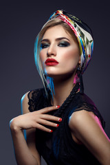 Fototapeta premium Beautiful girl with bright make-up and shawl on head