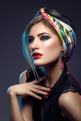 Beautiful girl with bright make-up and shawl on head