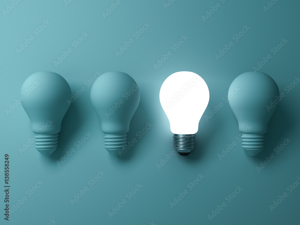 Leinwandbilder one glowing light bulb standing out from the unlit incandescent bulbs on green background , individu