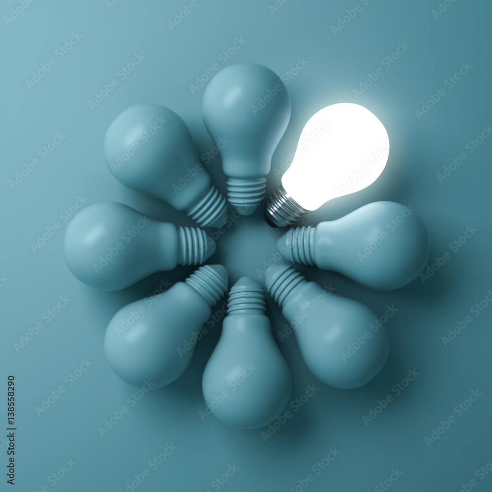 Aufkleber one glowing light bulb standing out from the unlit incandescent bulbs on green background with shado