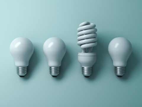 Energy saving light bulb , one compact fluorescent lightbulb standing out from unlit incandescent bulbs on green background , individuality and different creative idea concepts . 3D rendering.
