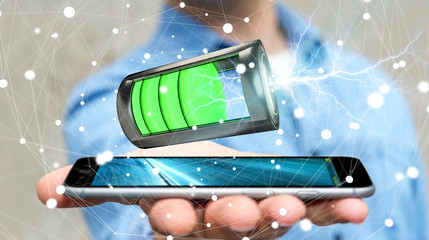Man holding 3D render battery with lightning over his phone © sdecoret