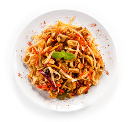 Rice noodles with meat, sauce and vegetables 