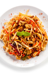 Rice noodles with meat, sauce and vegetables 