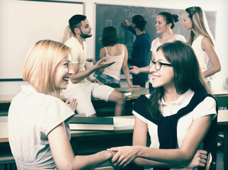 Smiling students during break in classroom