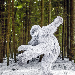 Yeti fairy tale character in winter forest. Outdoor fantasy photo. - obrazy, fototapety, plakaty
