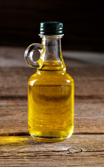 vegetable oil  bottle close-up on wooden background