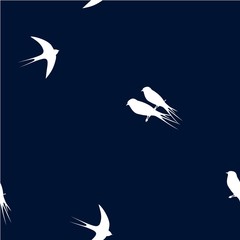Seamless pattern with white swallow birds on a dark blue background. It can be used for packing of gifts, tiles fabrics backgrounds. Raster copy.
