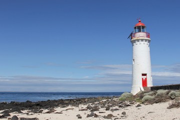 Fototapeta na wymiar Lighthouse on the Shore