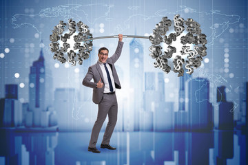 Businessman lifting barbell with dollars