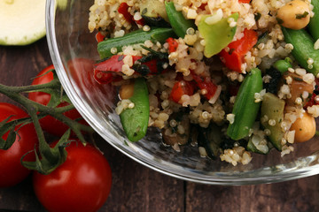 Delicious vegetarian quinoa salad with bell pepper, cucumber and tomatoes