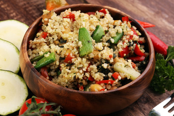 Delicious vegetarian quinoa salad with bell pepper, cucumber and tomatoes