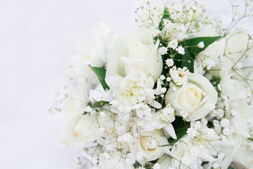 Obraz na płótnie Canvas White roses wedding bouquet lying down. Isolated on white.