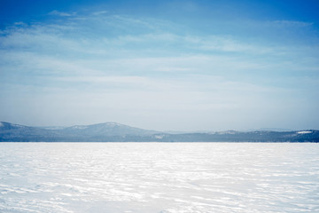 Naklejka na ściany i meble landscape of a frozen mountain lake