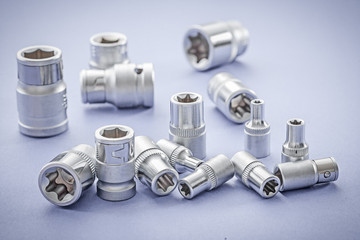 automobile torx and hexkeys on blue background