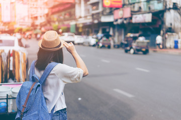 Young woman traveler looking the way in bangkok china town