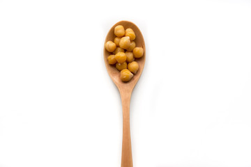 Isolated beans on wooden spoon