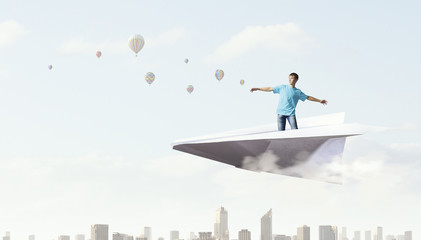 Hipster guy surfing sky    . Mixed media