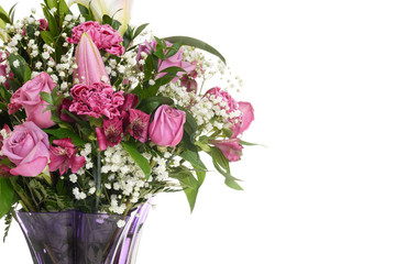 closeup bouquet pink roses with lilies and carnations