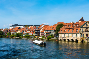 Fototapeta na wymiar Boats on the Regnitz River in Bamberg