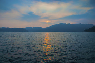 Sunset above mountain with reflex on water at Sun Moon Lake , Taiwan