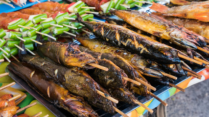 Street food stalls selling seafood, grilled chicken, BBQ, there are many in the country, Phuket Thailand..