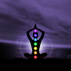 Silhouette trace of human meditating in lotus position. Colored chakra lights over body. Yoga, zen, Buddhism, recovery, religion, healthcare and wellbeing concept.