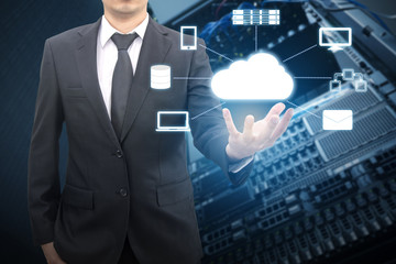 Professional businessman connecting network on hand in Cloud technology with datacenter server and storage background, communication and business concept