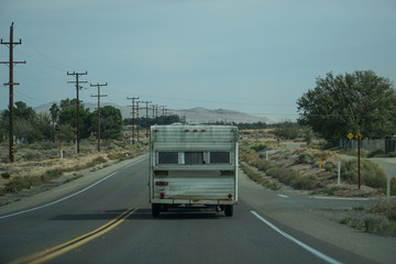 Fototapeta na wymiar RV Caravan Driving On The Road