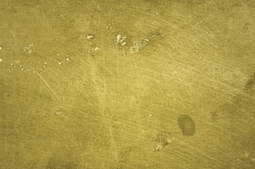 Scratched brass plate texture. Old metal background.