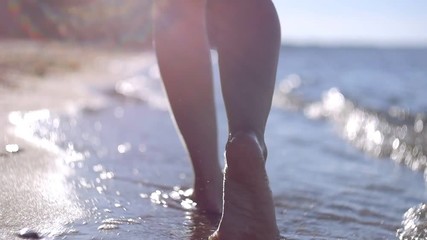 Girl walking on the beach - Powered by Adobe