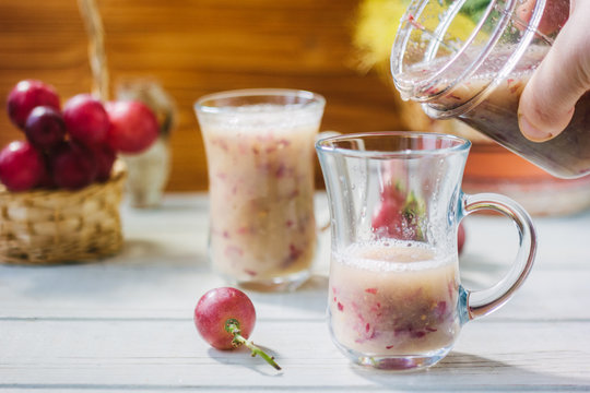 Grape Smoothie Over The White Table.