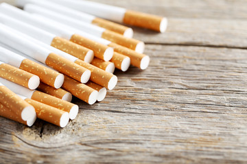 Tobacco cigarettes on a grey wooden table