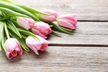 Bouquet of tulips on a grey wooden table