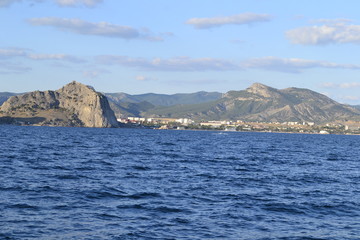 sea,beach,Crimea,Sudak,fortress,castle,Genoese fortress,Ukraine,mountains,cliffs,rocks, sea,sky,blue sky,sun,sea, stones,waves,spray,water,cat,gray cat,cat,smoothie,drink,glass,cherry,cocktail,Seagull