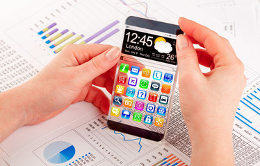 Smartphone with transparent screen in human hands.