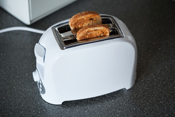 A toaster with slices of bread